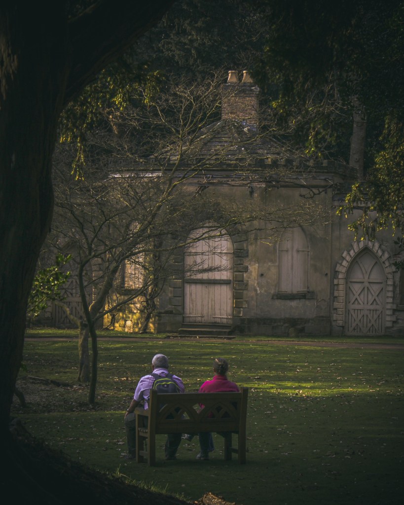 couple sat on a bench at nostell priory, west yorkshire