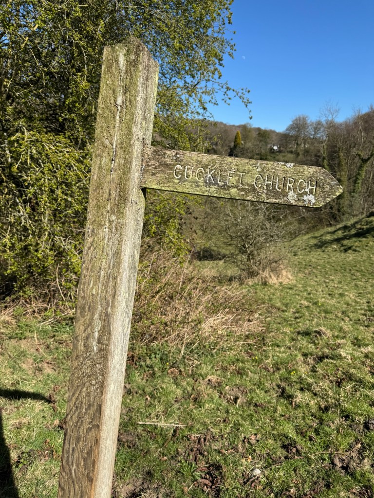 Wooden signpost for Cucklet Church
