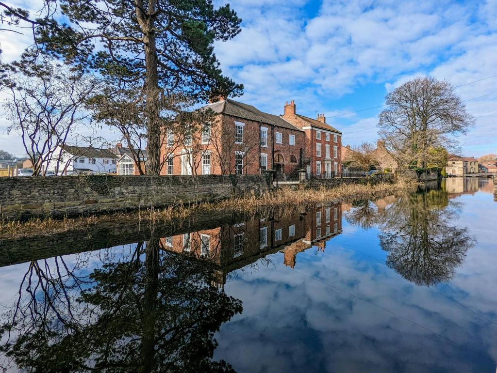 charming canal reflection in ripon yorkshire